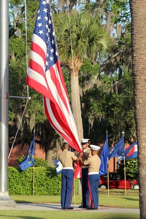 Marines prepare to raise the American flag at Parris Island.