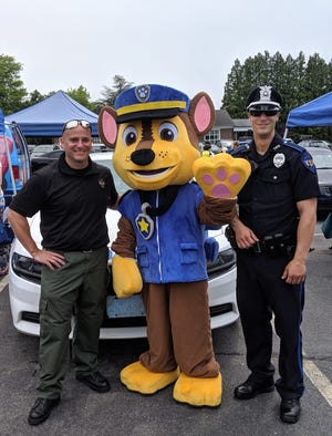 The Tiverton Police Department held its annual Child Safety Day, which was attended by well over 300 people from Tiverton and surrounding communities who were treated to officers cooking them complimentary hamburgers and hot dogs while families enjoyed various activities.