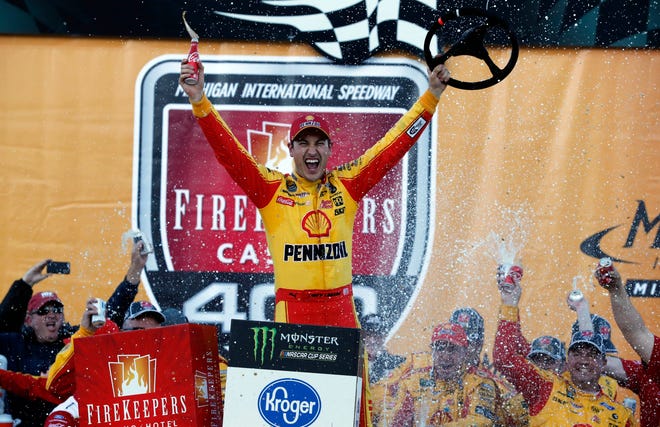 Joey Logano reacts after winning a NASCAR Monster Energy Cup Series race at Michigan International Speedway on Monday in Brooklyn, Mich. [Carlos Osorio/The Associated Press]