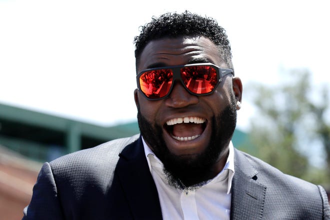 Retired Red Sox designated hitter David Ortiz smiles during a 2017 appearance outside Fenway Park in Boston. Ortiz returned to Boston for medical care after being shot in a bar Sunday in his native Dominican Republic. [File Photo/The Associated Press]