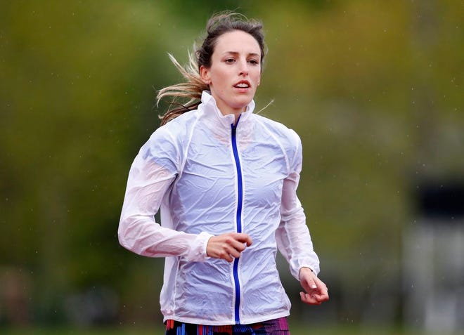 In this May 8, 2017 file photo, Gabriele "Gabe" Grunewald trains at Macalester College in St. Paul, Minn. Grunewald, one of the country's top middle-distance runners, has died at her home in Minneapolis after inspiring many with a long and public fight against cancer. Her husband, Justin Grunewald, posted on Instagram about her death late Tuesday, June 11, 2019 and confirmed it Wednesday in a text to The Associated Press. [Carlos Gonzalez/Minneapolis Star Tribune]