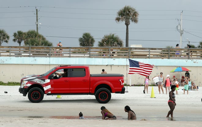 Trucks cruise the beach prior to the start of Truck Meet in Daytona Beach, Thursday, June 6, 2019. [News-Journal/Nigel Cook]
