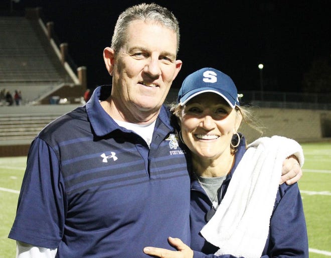 Debby Winder poses with her husband, Greg Winder, after one of the Yellow Jackets' football games. Greg is now the offensive coordinator for Lewisville High School, and Debby will be the new head athletic trainer at nearby Lake Dallas High School. They still have a home in Stephenville.