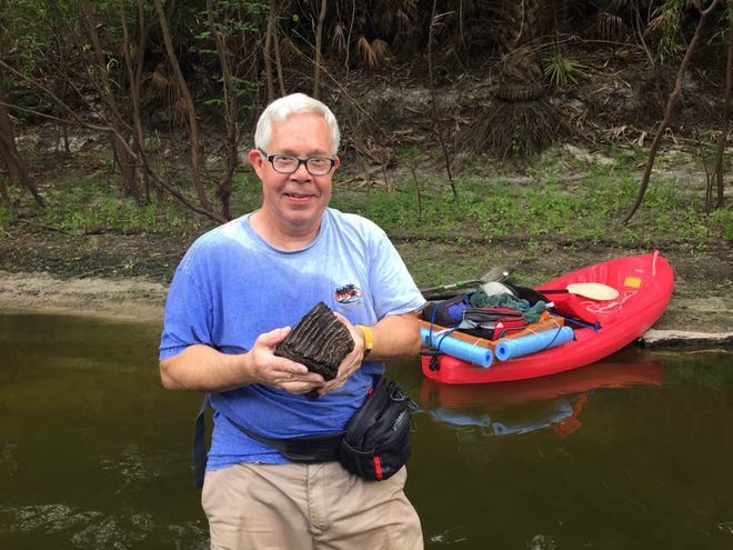 Bryan Roberts, vice president of the Manasota Fossil Club, found this ancient woolly mammoth molar in the Peace River. [Photo courtesy of Bryan Roberts]