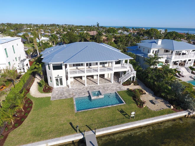 This home at 639 Key Royale Drive in Holmes Beach sold for $3.725 million in late May — a record sale for a bayside property on Anna Maria Island, according to Premier Sotheby’s International Realty. [Photo courtesy of Premier Sotheby’s]