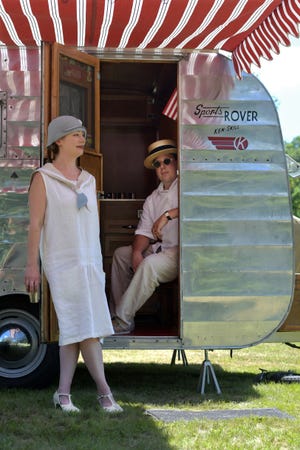 Nicole Watson and Vincent Hemmeter are pictured in their 1950 Kenskill Sports Rover while camping out during a Cars of Summer event in Green Hill Park.