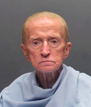 FILE - This file photo released on Jan. 14, 2018, by the Tucson Police Department shows Robert Francis Krebs, who has a decades-long criminal record for stealing from banks. The 81-year-old is charged with robbing a credit union in Tucson in January 2018. Attorneys in his latest criminal case are arguing about whether Krebs is mentally competent to stand trial. (Tucson Police Department via AP, File)