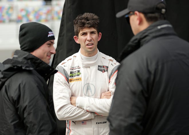 Making his sixth appearance in the 24 Hours of Le Mans this weekend, Ricky Taylor, center, is looking to add to his family’s legacy of success in the prestigious French endurance race. [AP Photo/John Raoux, File]
