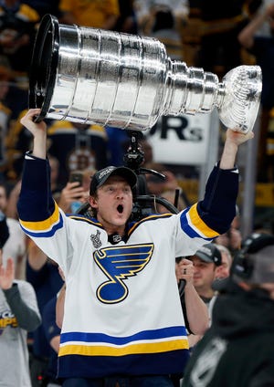 St. Louis Blues' Jay Bouwmeester carries the Stanley Cup after the Blues defeated the Boston Bruins in Game 7 of the NHL Stanley Cup Final, Wednesday, June 12, 2019, in Boston. (AP Photo/Michael Dwyer)