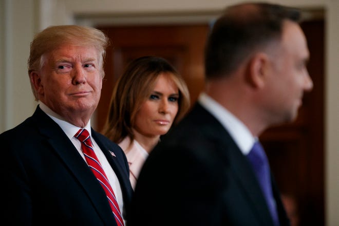 President Donald Trump and first lady Melania Trump attend a Polish-American reception with Polish President Andrzej Duda in the East Room of the White House, Wednesday June 12, 2019. (AP Photo/Jacquelyn Martin)