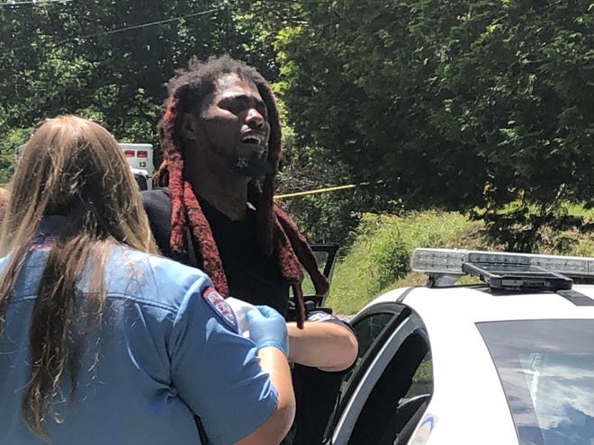 Police say this man was responsible for an attempted murder in Charlotte. He was loaded into a police car in Gastonia on Thursday. [KEN LEMON/WSOC]