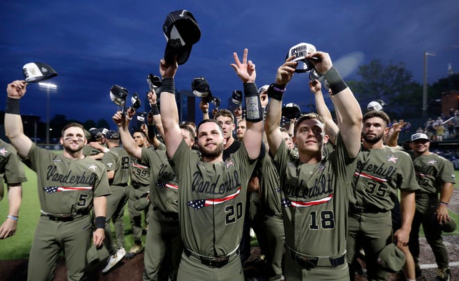 Vanderbilt players tip their caps to the crowd after an NCAA super regional victory over Duke on Sunday in Nashville, Tenn. The Commodores open the College World Series on Sunday, but two of their players are in Newport with the Gulls, ready to cheer them on. [THE ASSOCIATED PRESS]