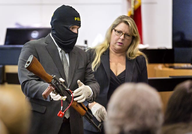 Agent Brandon Rhodes of the Jupiter Police Department and Assistant State Attorney Jill Richstone show the jury a rifle found in a culvert alongside I-95 during Rhodes' testimony in the first-degree murder trial of Christopher Vasata Thursday morning in West Palm Beach June 13, 2019. Vasata faces the death penalty if convicted. Vasata is one of two men charged in the Feb. 5, 2017 fatal shooting of Brandi El-Salhy, 24, Kelli J. Doherty, 20, and Sean P. Henry, 26, in Jupiter on Super Bowl Sunday. [LANNIS WATERS/palmbeachpost.com]
