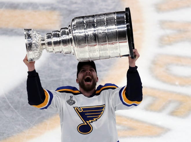 St. Louis Blues' David Perron carries the Stanley Cup after the Blues defeated the Boston Bruins in Game 7 of the NHL Stanley Cup Final, Wednesday, June 12, 2019, in Boston. (AP Photo/Charles Krupa)