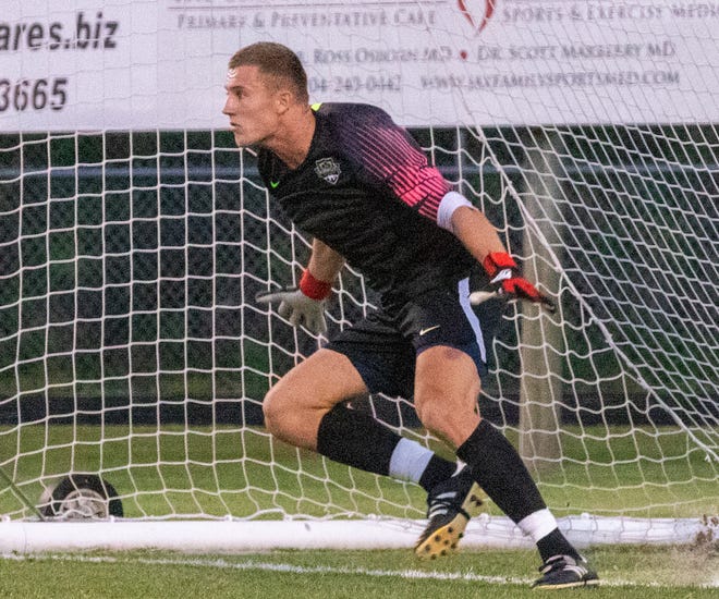 Florida Elite goalkeeper Patrick Timmer ties to stop a penalty kick during a May 18, 2019 USL League Two match against The Villages SC. Timmer has a 0.84 goals against average in 322 minutes entering Thursday's match against the Treasure Coast Tritons. [WILL BROWN/ THE RECORD]