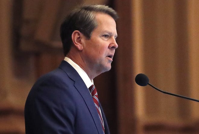 FILE - In this April 2, 2019, file photo, Georgia Gov. Brian Kemp, right, speaks to members of the Georgia House during the final 2019 legislative session at the state Capitol in Atlanta. A lawsuit challenging Georgia's election system can move forward, a judge ruled Thursday, May 30, in the legal case filed by a group founded by former Democratic gubernatorial candidate Stacey Abrams. (AP Photo/John Bazemore)