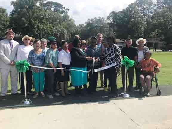 Residents of Sylvan Terrace, along with city officials and State Rep. J. Craig Gordon (D-District 163), gathered at the new Sylvan Terrace Park on Thursday to celebrate the park's opening with a ribbon cutting. [DeAnn Komanecky/savannahnow.com]