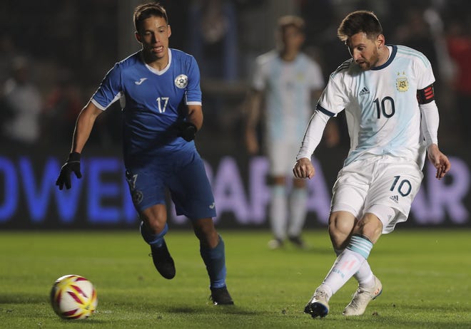 Argentina's Lionel Messi, right, scores against Nicaragua in a friendly last week. [Nicolas Aguilera/The Associated Press]