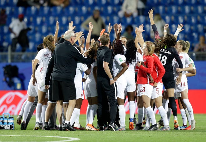 Canadian team celebrate after their 1-0 win in their Women's World Cup Group E soccer match between Canada and Cameroon in Montpellier, France, Monday, June 10, 2019. (AP Photo/Claude Paris)