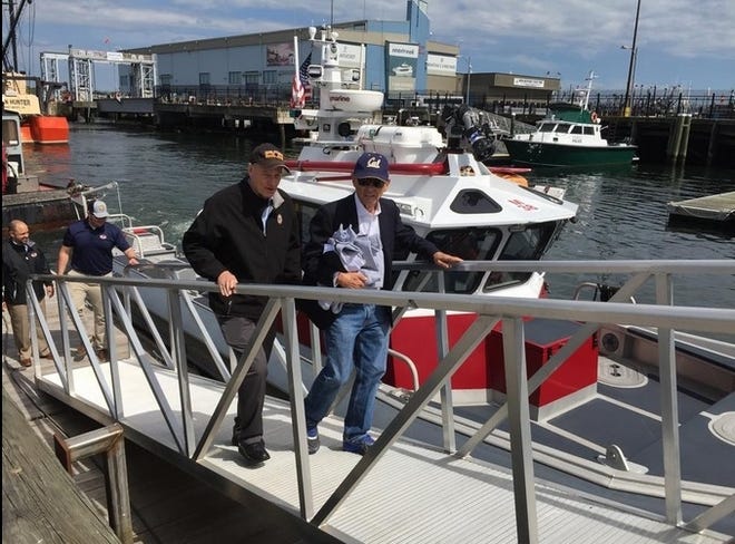 Congressman William Keating, D-Mass., left, and Congressman Alan Lowenthal, D-Calif., disembark after touring New Bedford Harbor as part of a visit they made to show Lowenthal the city's potential as a port for offshore wind. [Standard-Times Photo | Jennette Barnes]