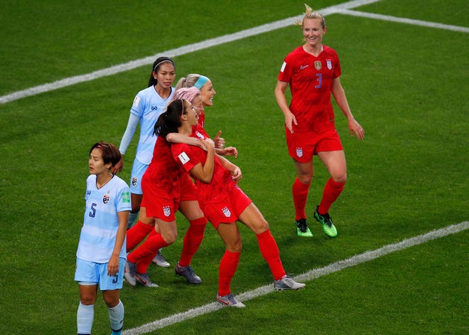 United States' Alex Morgan, center, celebrates with teammates after scoring her team's fifth goal during the Women's World Cup match this week in France. [AP Photo/Francois Mori]