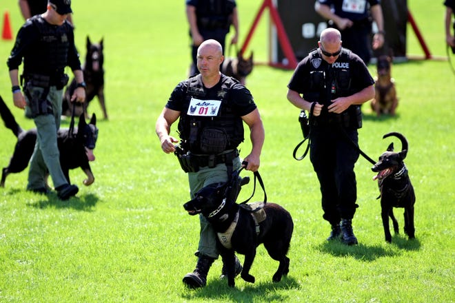 Palm Beach Sheriff's Office canine officer Justin Rigney, center, during a demonstration in 2012. Rigney, who has retired, fatally shot Ricky Whidden, of Loxahatchee, in 2016. [GARY CORONADO/palmbeachpost.com]