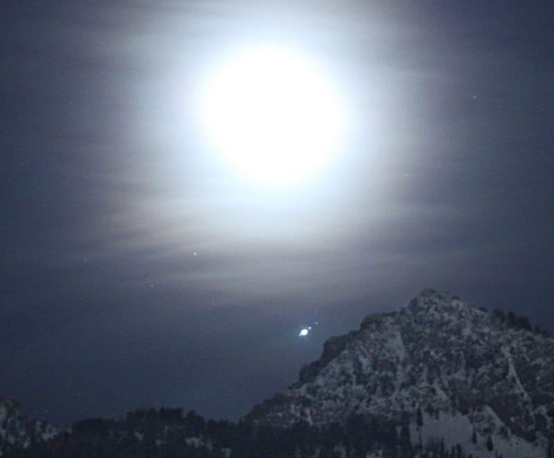 Looking Up: Earth's moon passing by Jupiter's moons