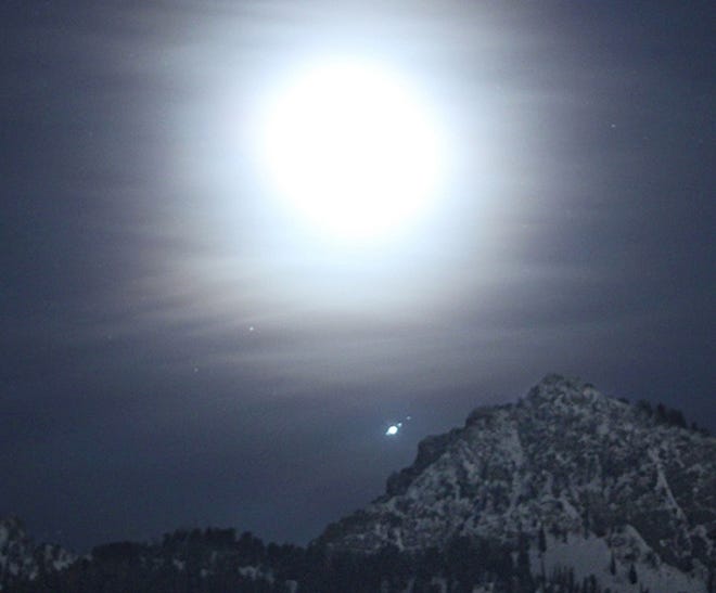 Earth’s moon, near Jupiter and its moons, pictured Feb. 27, 2019, over the Wasatch Mountains near Salt Lake City. Visible from left next to Jupiter are Europa, Ganymede and Callisto. [NASA/Bill Dunford]