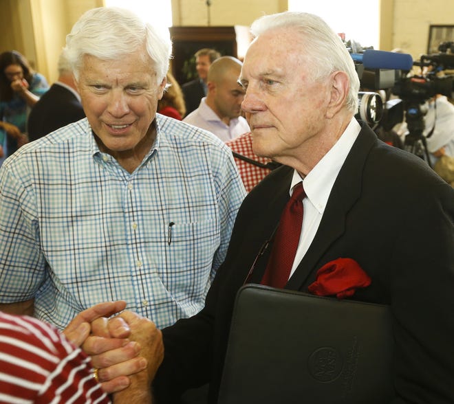 Bill Battle stands with Dr. Gaylon McCollough during a ceremony in 2017 honoring McCollough and his wife Susan, who gave the largest endowed gift to the College of Arts and Sciences at the University of Alabama in the last 20 years. McCollough has written a memoir, 'Victory in the Game of Life,' which pays tribute to those who helped him achieve success. [Staff Photo/Gary Cosby Jr.]