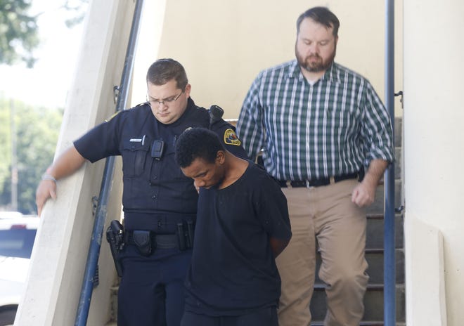 Investigators escort 27-year-old Christopher Cornelius Pearson to jail after he was charged with murder in the death of a 1-year-old child Friday, June 14, 2019. [Staff Photo/Gary Cosby Jr.]