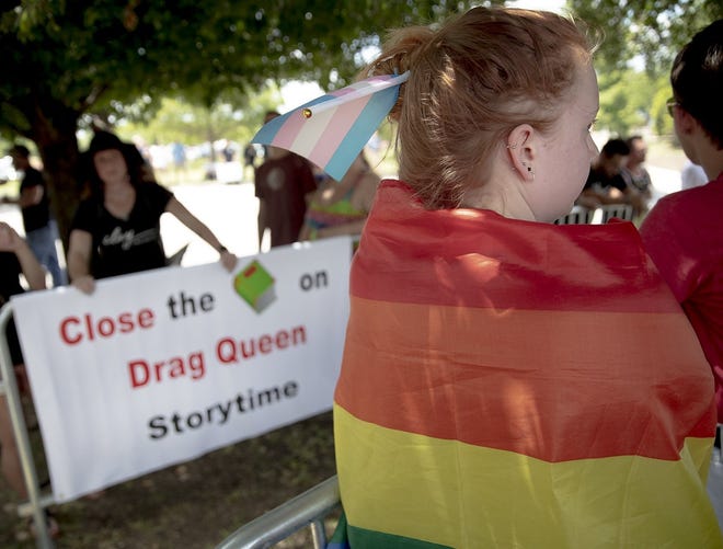 An anti-LGBTQ protester holds up a sign during a demonstration outside of the Leander Public Library, the site of a private event sponsored by a Leander church and described as a "Family Pride Festival and Story Time." (Photo: Nick Wagner, Austin American-Statesman)