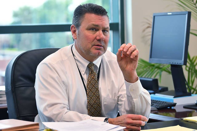 District Attorney Andy Gregson discusses the new Raise the Age law during an interview. (Paul Church / The Courier-Tribune)