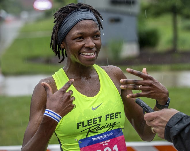 Jane Bareikis, of Crestwood, Ill., who has only been running for two years and entered the Steamboat Classic for the first time, talks Saturday, June 15, 2019, about the excitement of winning the Women's 4-mile championship. [DAVID ZALAZNIK/JOURNAL STAR]