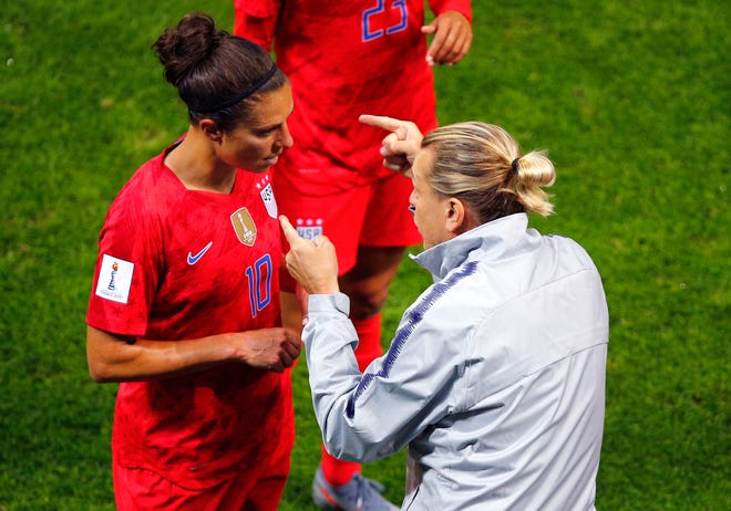 United States' coach Jill Ellis gestures as she talks to her player Carli Lloyd during the Women's World Cup Group F match against Thailand at the Stade Auguste-Delaune on Tuesday in Reims, France. [Francois Mori/The Associated Press]