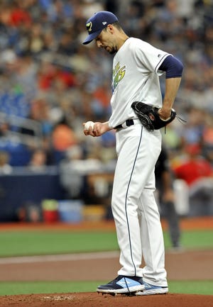 Tampa Bay Rays starter Charlie Morton looks at the ball between pitches against the Los Angeles Angels during the first inning Saturday at Tropicana Field in St. Petersburg. [The Associated Press / Steve Nesius]