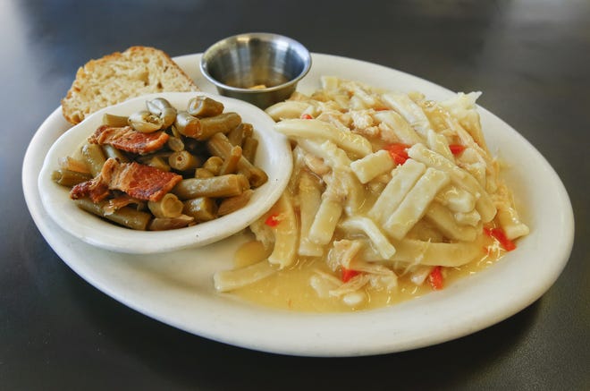 Diner 24 offers homemade chicken and noodles over mashed potatoes with homemade bread and a choice of green beans or corn for $9.99. [Chris Neal/The Capital-Journal]