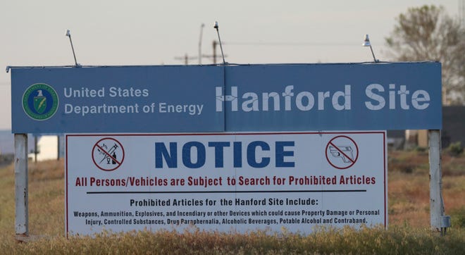 Signs are posted by the Hanford Nuclear Reservation in Richland, Wash. [Manuel Valdes/Associated Press file]