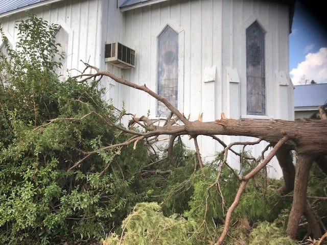 A tree toppled by Michael did less damage than winds that knocked the church off its foundation

{Special to The Star}