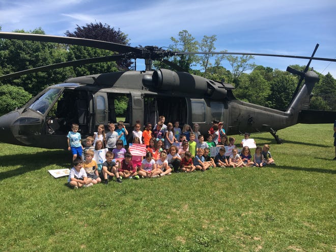 Kindergartners pose for a class photo in front of the Black Hawk helicopter that visited Manomet Elementary School for Military Appreciation Day Wednesday.

[Wicked Local photo/Rich Harbert]