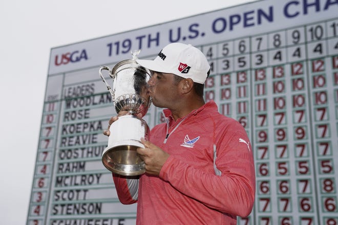 The U.S. Open trophy was a sweet reward Sunday for 35-year-old Gary Woodland, who had never won a major. [Carolyn Kaster/The Associated Press]