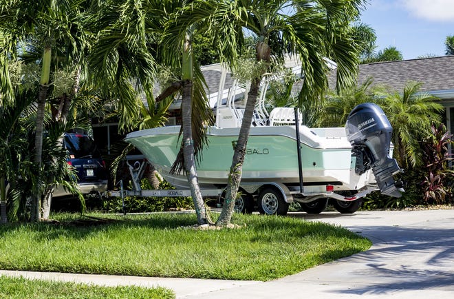 A boat is parked in an open driveway on Quadrant Road in North Palm Beach in this 2018 photo. [RICHARD GRAULICH/palmbeachpost.com]