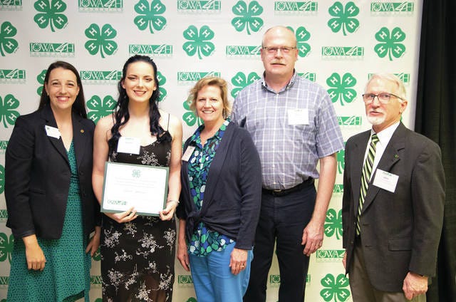 Iowa 4-H Foundation Executive Director Emily Saveraid, left, presents Lauren Hansen, of Story City, with a scholarship from the Iowa 4-H Foundation during the scholarship reception on June 2 in Ames. Pictured are, from left, Emily Saveraid, Lauren Hansen, Gina Smith, Brian Smith and John Lawrence. Contributed photo
