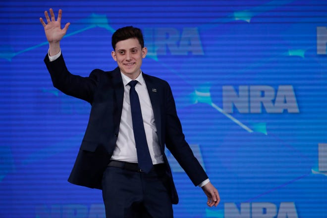 FILE - In this April 26, 2019 file photo, Kyle Kashuv, a survivor of the Marjory Stoneman Douglas High School shooting in Parkland, Fla., speaks at the National Rifle Association Institute for Legislative Action Leadership Forum in Indianapolis. On Monday, June 17, 2019, Kashuv said that Harvard University revoked his acceptance over racist comments he made online and in text messages about two years ago. (AP Photo/Michael Conroy, File)