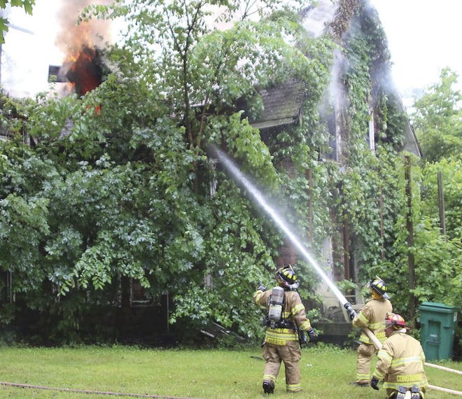 Firefighters battled fire Sunday at a home in Constantine.