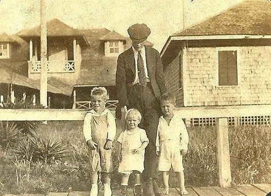 John Barry Sr. with his children John, Jr., Lucille, and Bud in front of the Carolina Yacht Club in 1920. [CONTRIBUTED PHOTO]