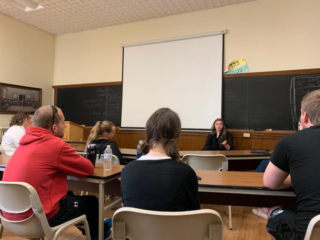 Dani Fitzgerald, a multimedia content editor with the Beaver County Times, answers questions about journalism April 2 at Geneva College in Beaver Falls. [Submitted]