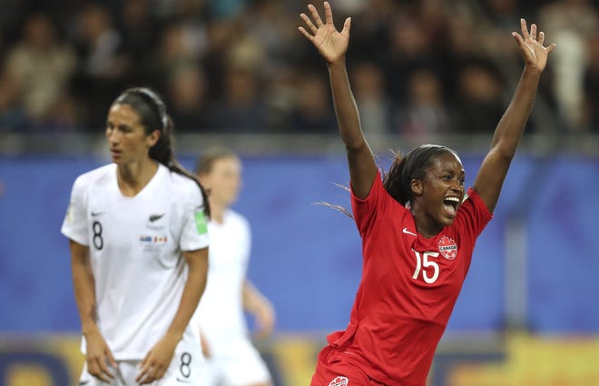 Canada's Nichelle Prince, right, celebrates after scoring for the first time in the Women's World Cup in Canada's 2-0 win over New Zealand on June 15. [Francisco Seco/The Associated Press]