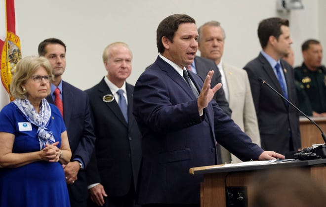 Florida Gov. Ron DeSantis speaks before signing the Sanctuary City bill Friday, June 14, 2019 at the Okaloosa County, Fla., Commission Chambers in Shalimar Fla. The bill requires all law enforcement agencies in Florida to cooperate with federal immigration authorities. (Michael Snyder/Northwest Florida Daily News via AP)