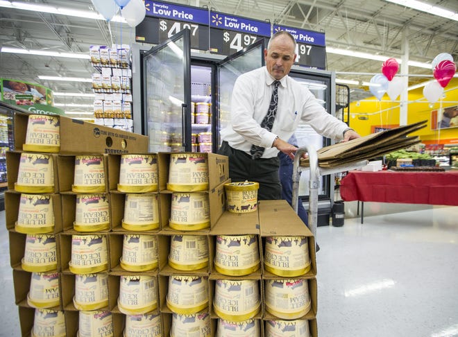 An employee stocks Blue Bell products at the Walmart Supercenter in Georgetown on Aug. 31, 2015, when the company resumed selling its products following a shutdown due to listeria contamination. A Delaware court has ruled that a lawsuit against Blue Bell filed by shareholders can go forward.

[RICARDO B. BRAZZIELL / AMERICAN-STATESMAN/FILE]