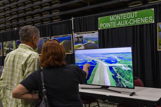 Participants in Terrebonne Parish's Coastal Day watch drone footage of the work at the Montegut and Pointe-aux-Chenes portion of the Morganza-to-the-Gulf levee system this afternoon in the Houma-Terrebonne Civic Center. [Halle Parker/Staff Writer -- houmatoday/dailycomet]